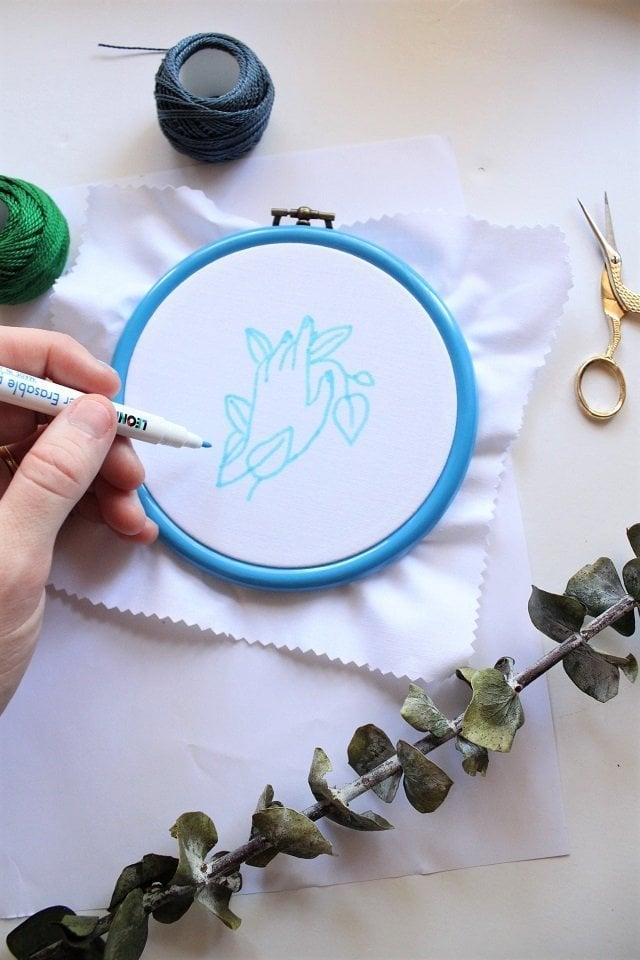 embroidery tools and materials - marker on fabric in an embroidery hoop