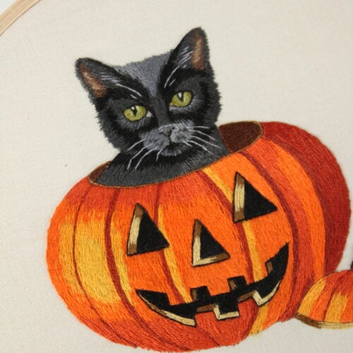 closeup of a black cat and pumpkin embroidery