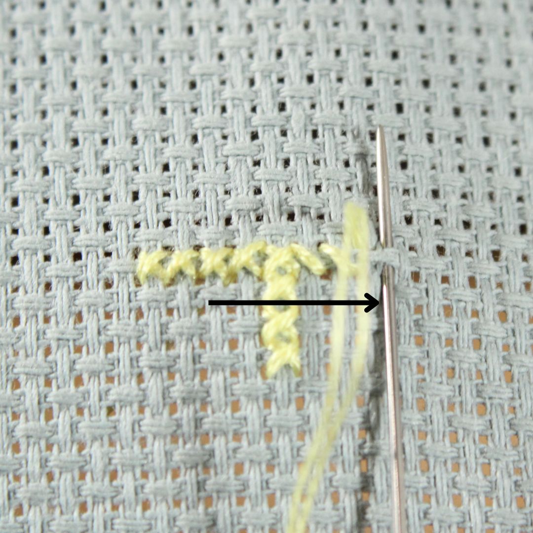 sewing horizontal row of cross stitches step 1