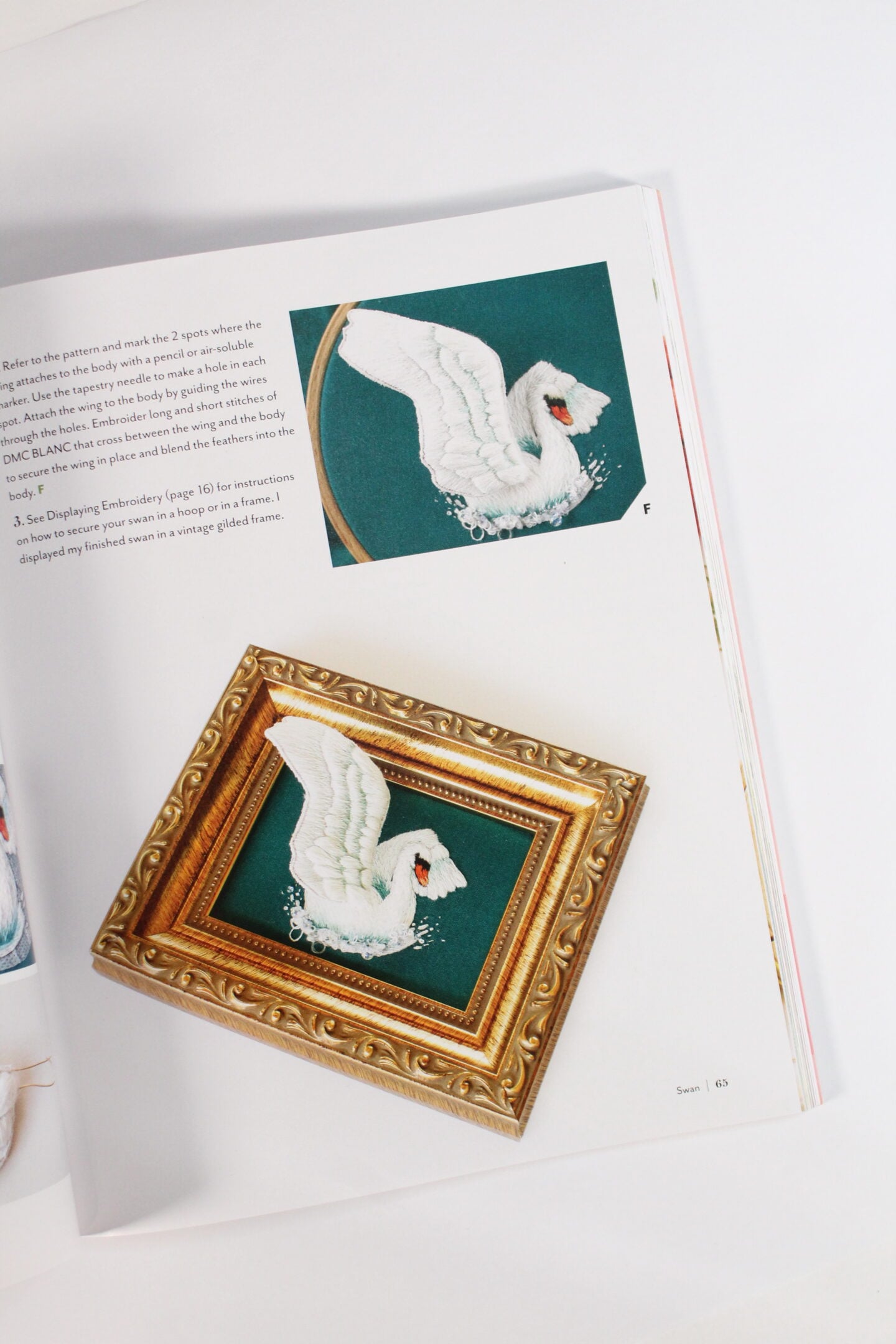 page of Stumpwork studio featuring a swan stumpwork embroidery by Megan Zaniewski