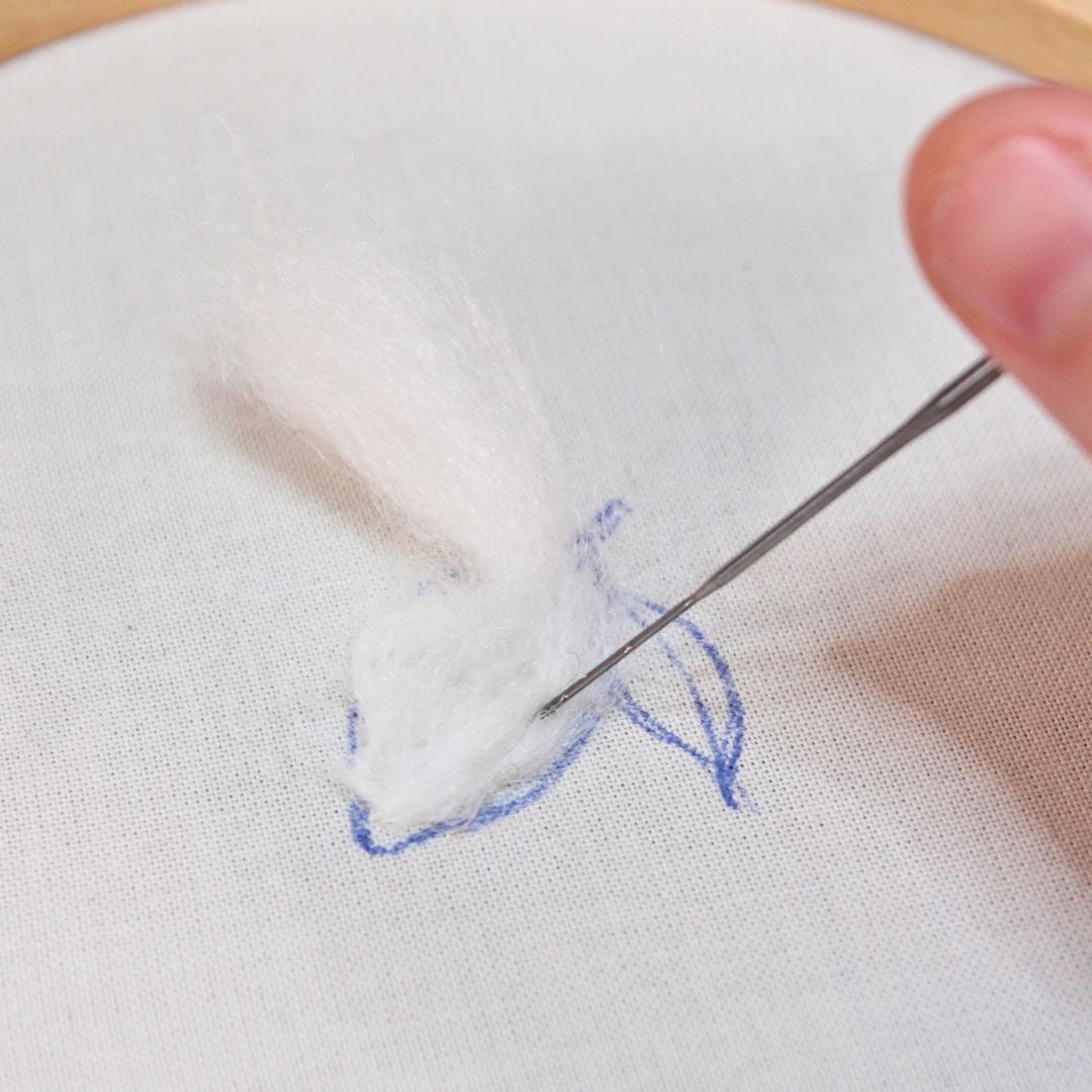 needle felting wool roving on the lemon step 1