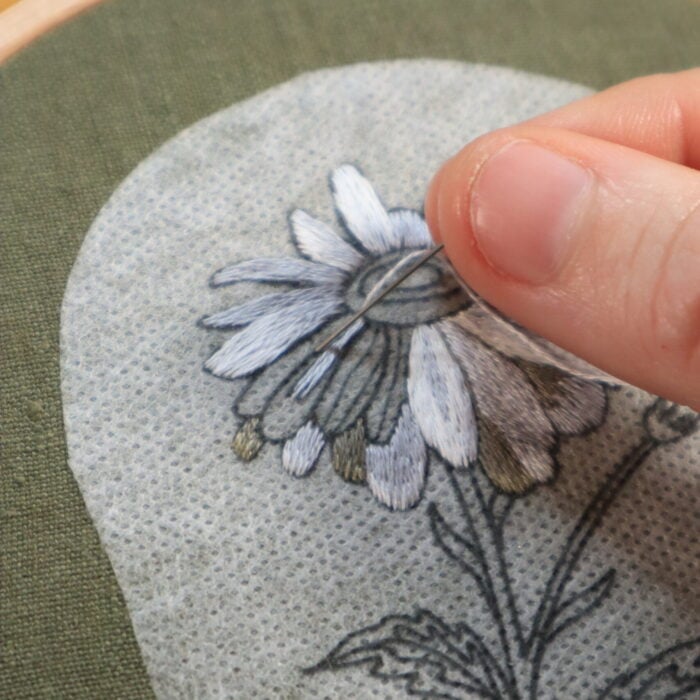 close up of the daisy embroidery being stitched